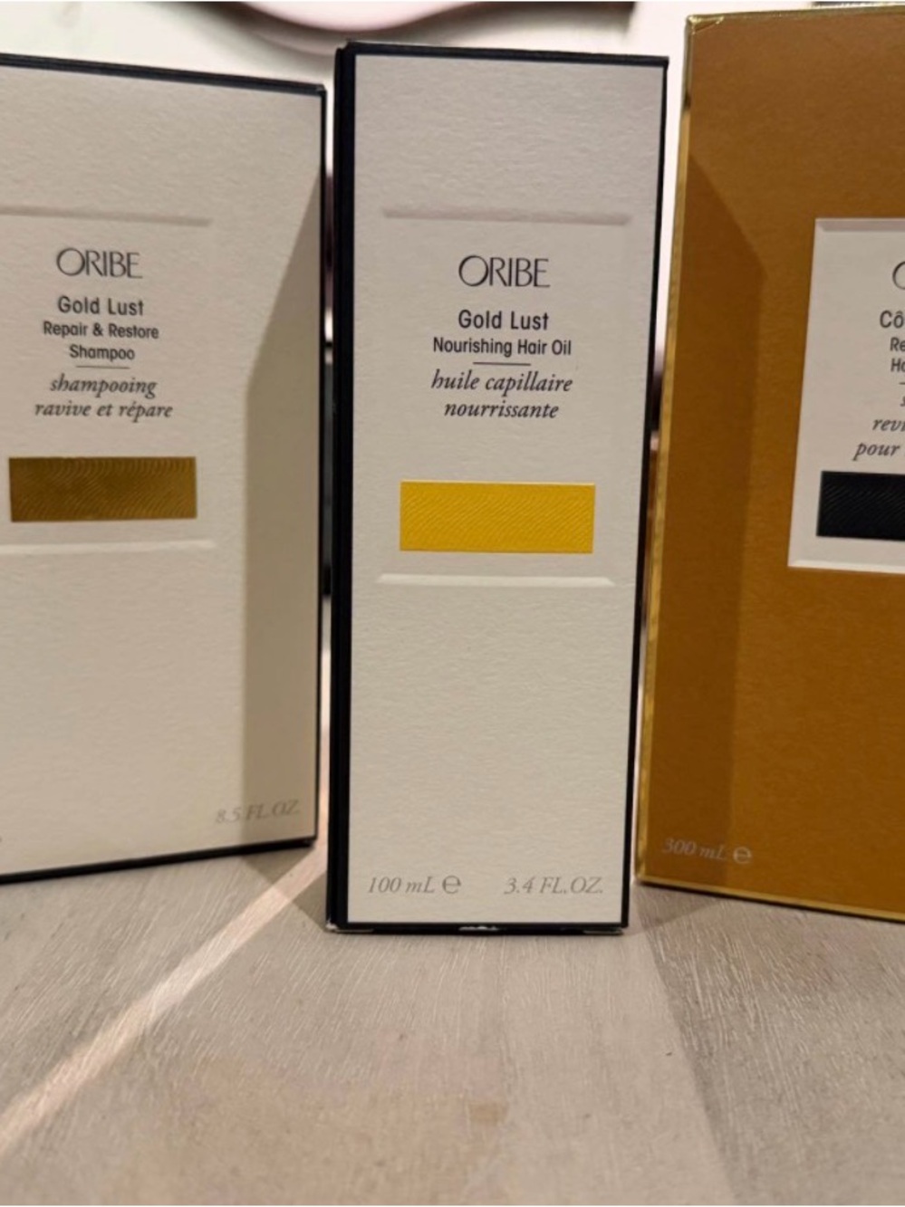 Oribe Gold Lust Nourishing Hair Oil — bright yellow packaging